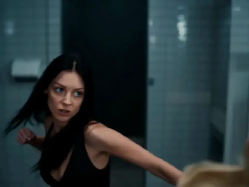 Cinematic AI-generated video of a dynamic fight scene between two women in a restroom, generated with AI video generation on ChatImages